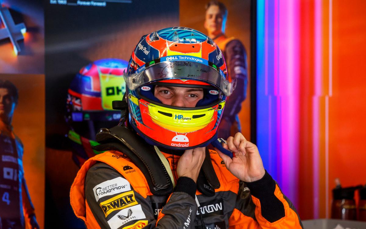 Oscar Piastri, McLaren, puts on his helmet ahead of qualifying